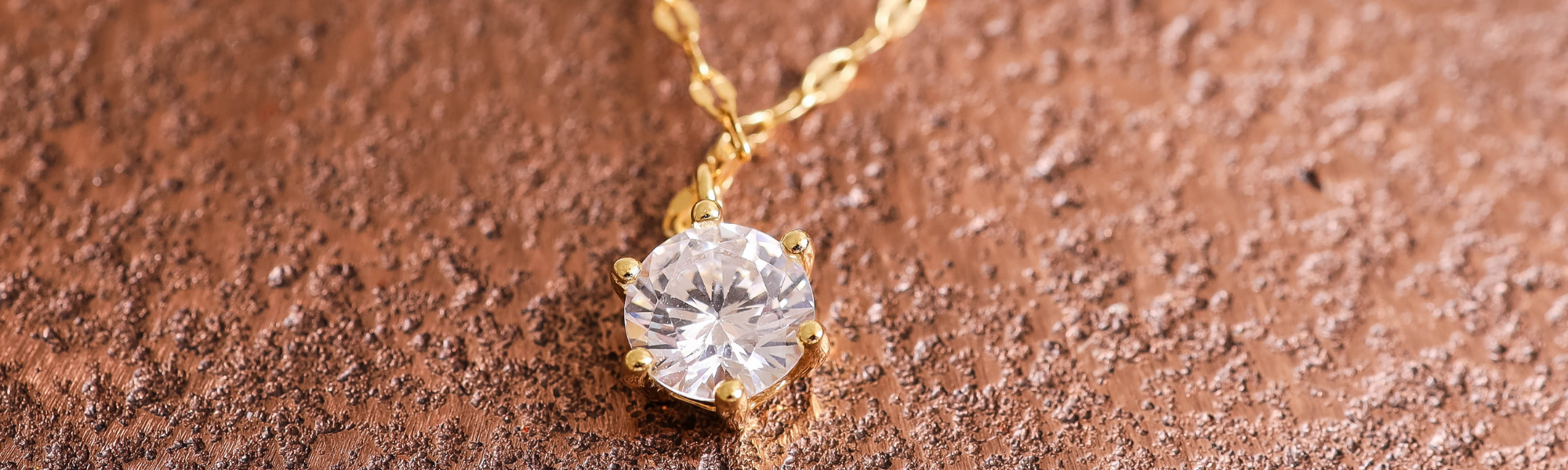 up close image of 18k gold plated cubic zirconia necklace by JACOBSVOW
