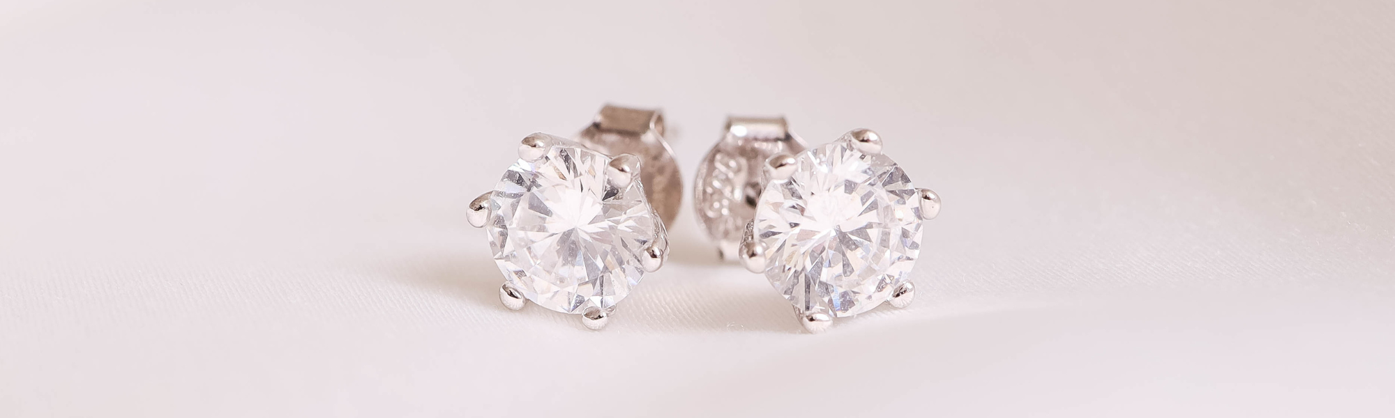 up close image of 6mm sterling silver cubic zirconia minimalist dainty stud earrings by JACOBSVOW